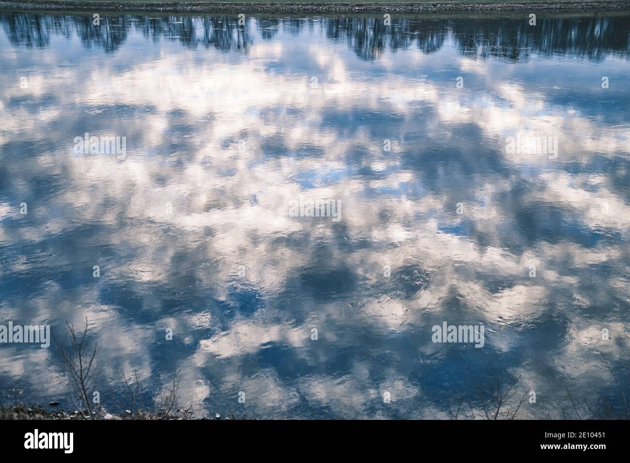 Reflexions of a cloudy sky in water at a lake/sea Stock Photo