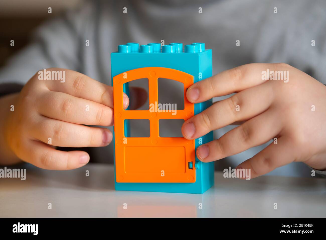 Playing Little Boy with Lego Blocks House Stock Photo
