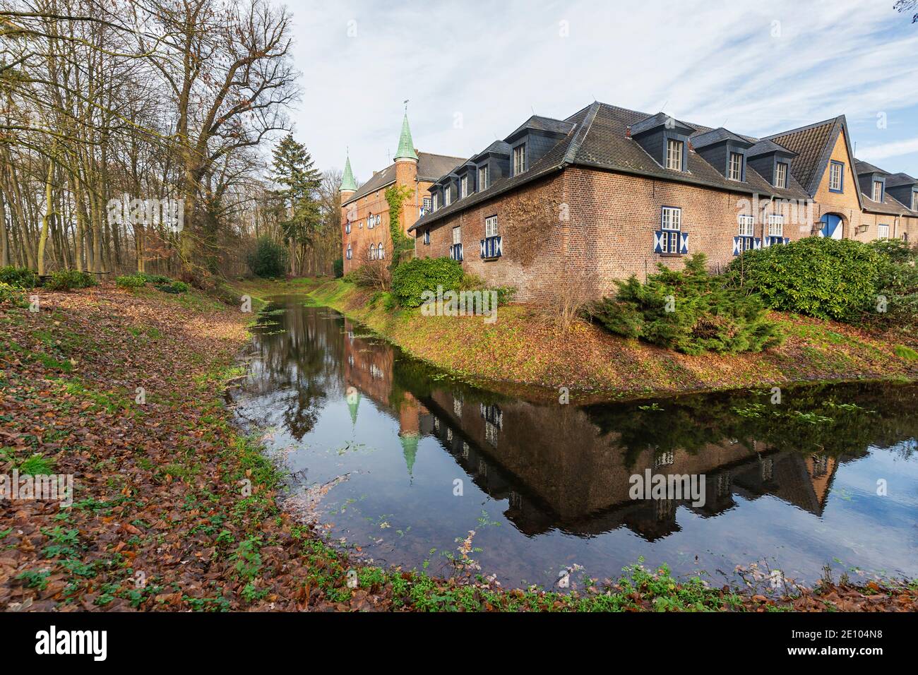 Geldern - View to Outer bailey and Manor House reflected in the moat  at Castle Walbeck,  North Rhine Westphalia, Germany, 19.12.2020 Stock Photo