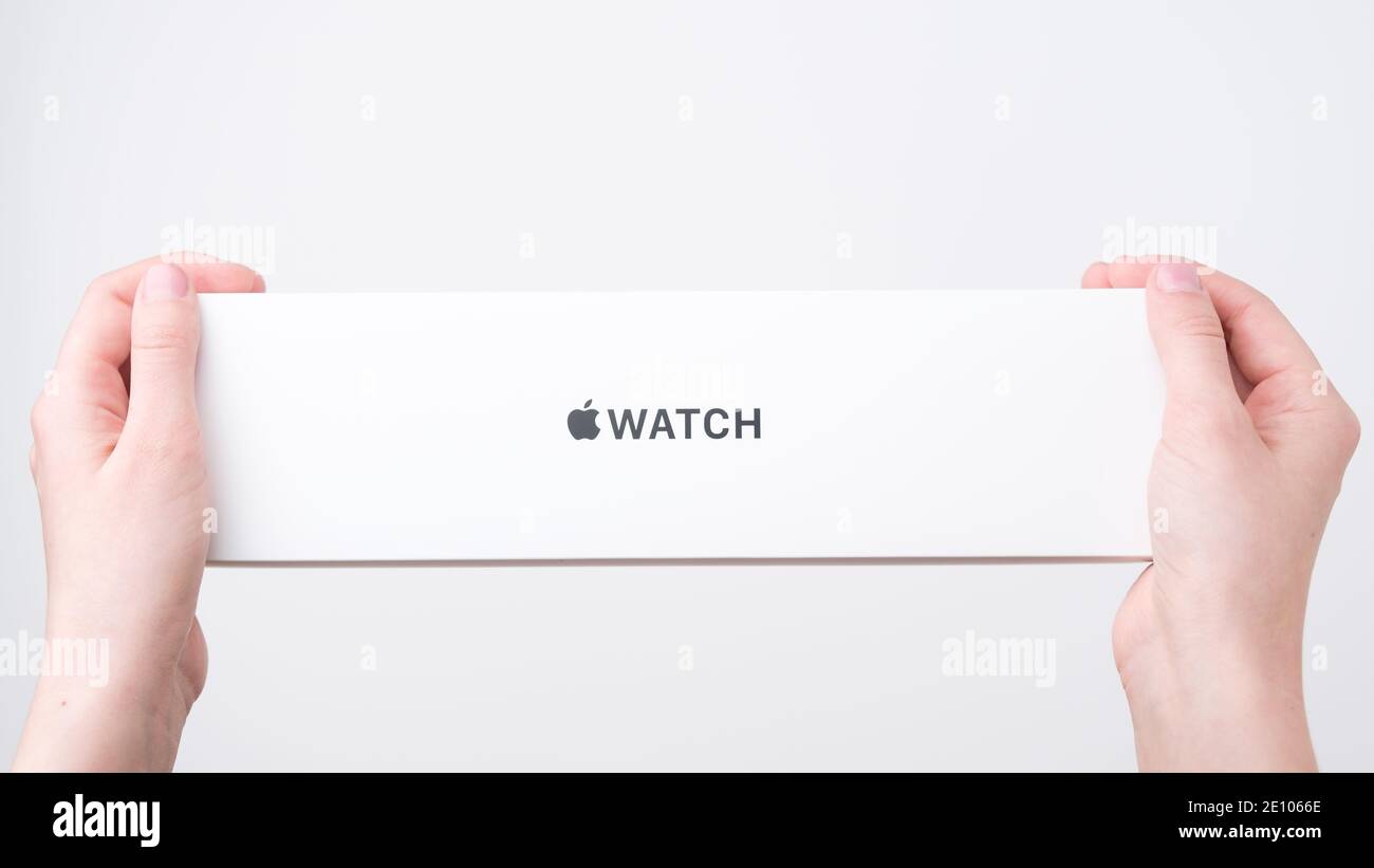 Apple watch box in woman hands on the grey background with copy space,  December 2020, San Francisco, USA Stock Photo - Alamy