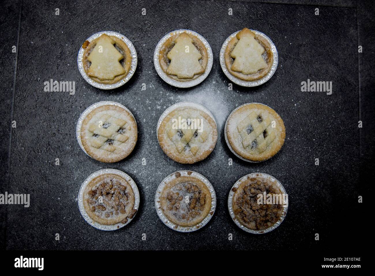Nine Christmas mince pies on a dark background Stock Photo