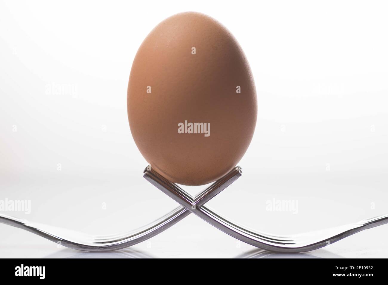 Chicken egg in balance and symmetry Stock Photo