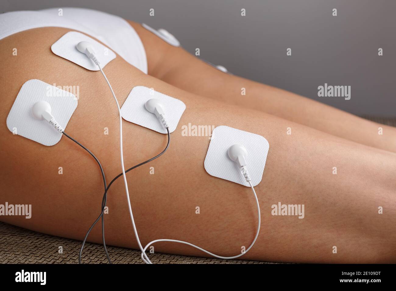 Muscle stimulator with electrodes, the massager on the buttocks and legs.  Rehabilitation and treatment, weight loss and. Soft contrast Stock Photo -  Alamy