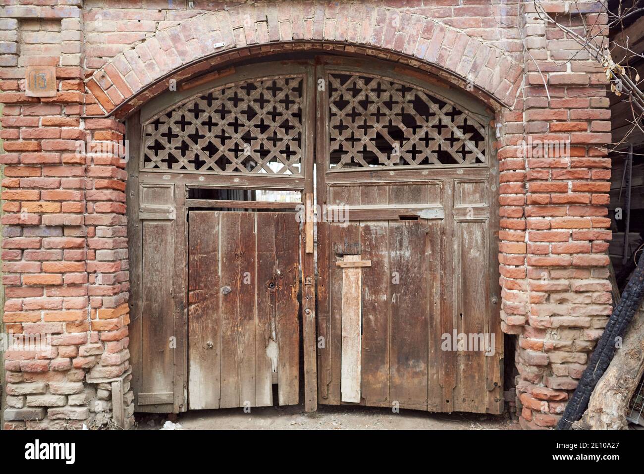 Antique wooden gate with cross-shaped grid Stock Photo - Alamy