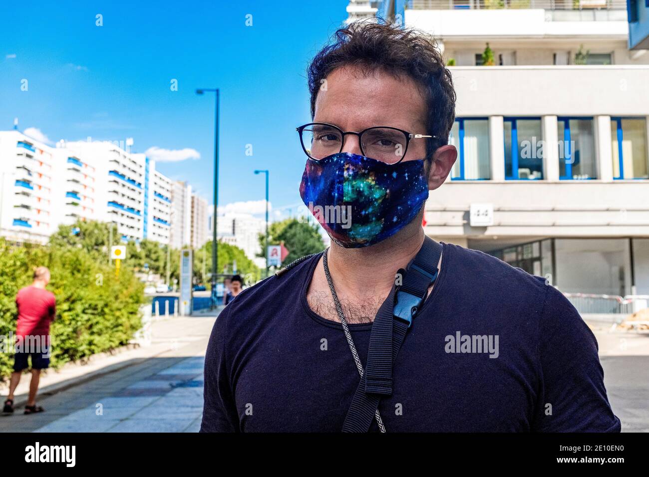 Berlin, Germany. Mature gay male shopping for groceries inside a local supermarket wearing a 'protective' facemask due to Corona Outbreak. In Germany Stock Photo