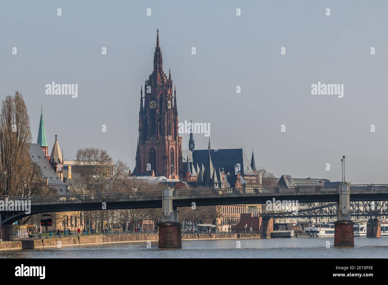 Cathedral in Frankfurt with the river Main. Spring day in the state capital of Hesse. Bridges over the river and park from the river bank with the lar Stock Photo