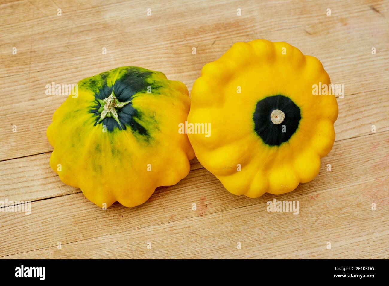 A Pair of Patty Pan Squash on a Cutting Board 2 Stock Photo