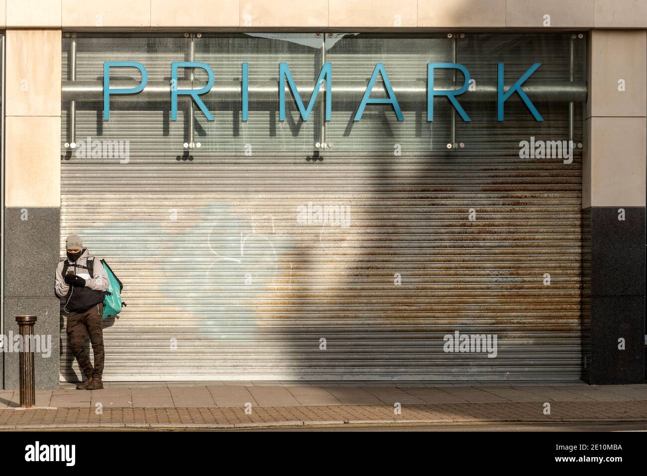 Brighton, January 3rd 2021: A man waiting outside a closed branch of ...