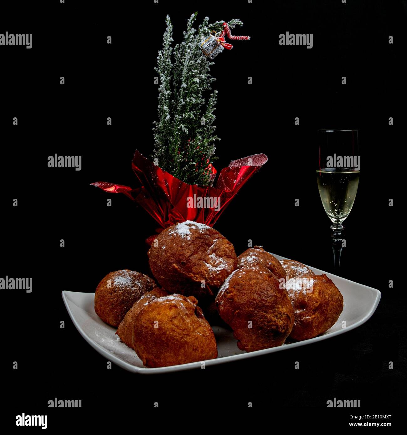 Deep fried buns (oliebol) and a glass of champagne is a typical Dutch
