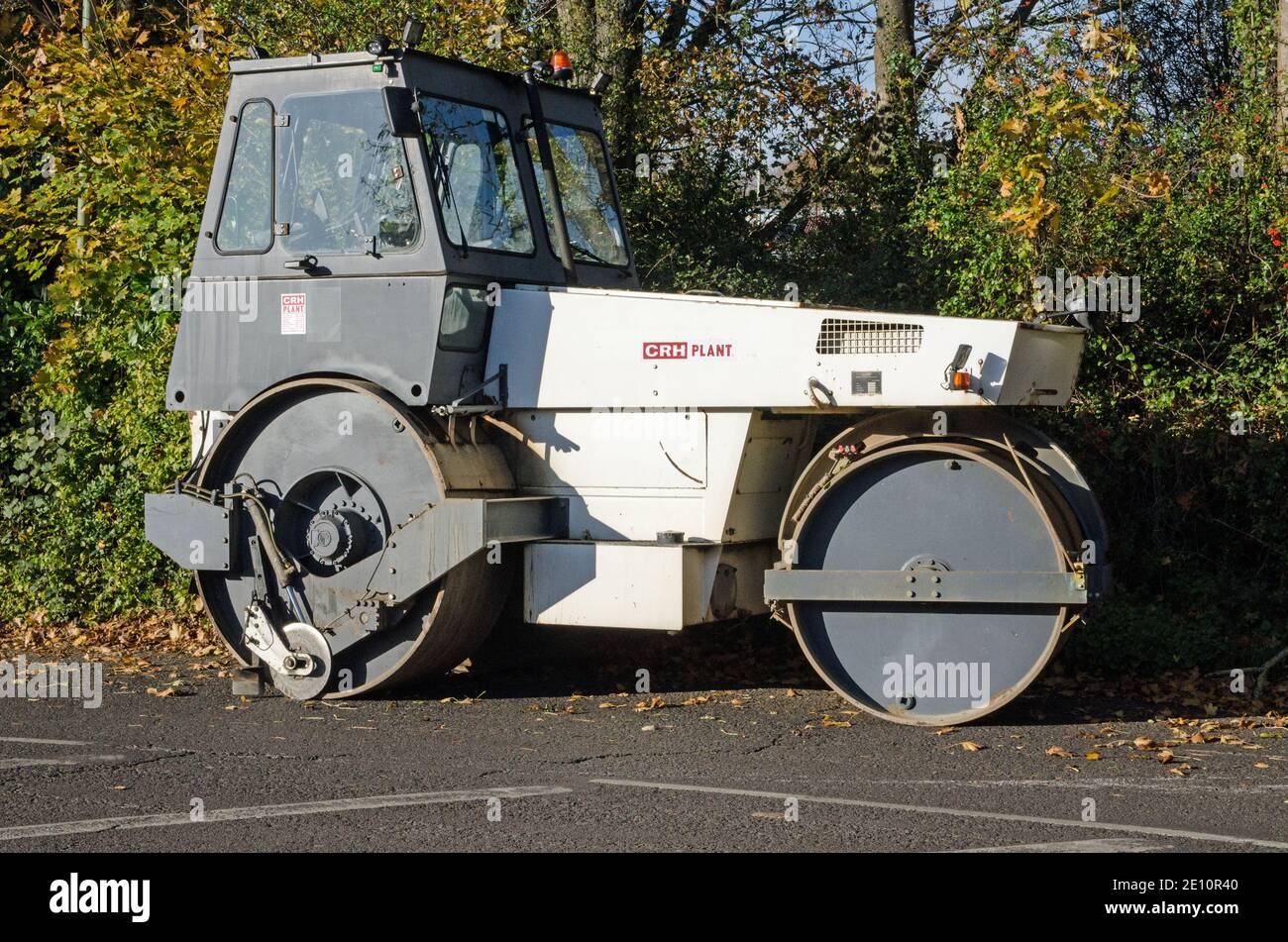 Basingstoke, UK - November 6, 2020:  Side view of a parked Hamm tandem road roller on a sunny autumn afternoon. Stock Photo