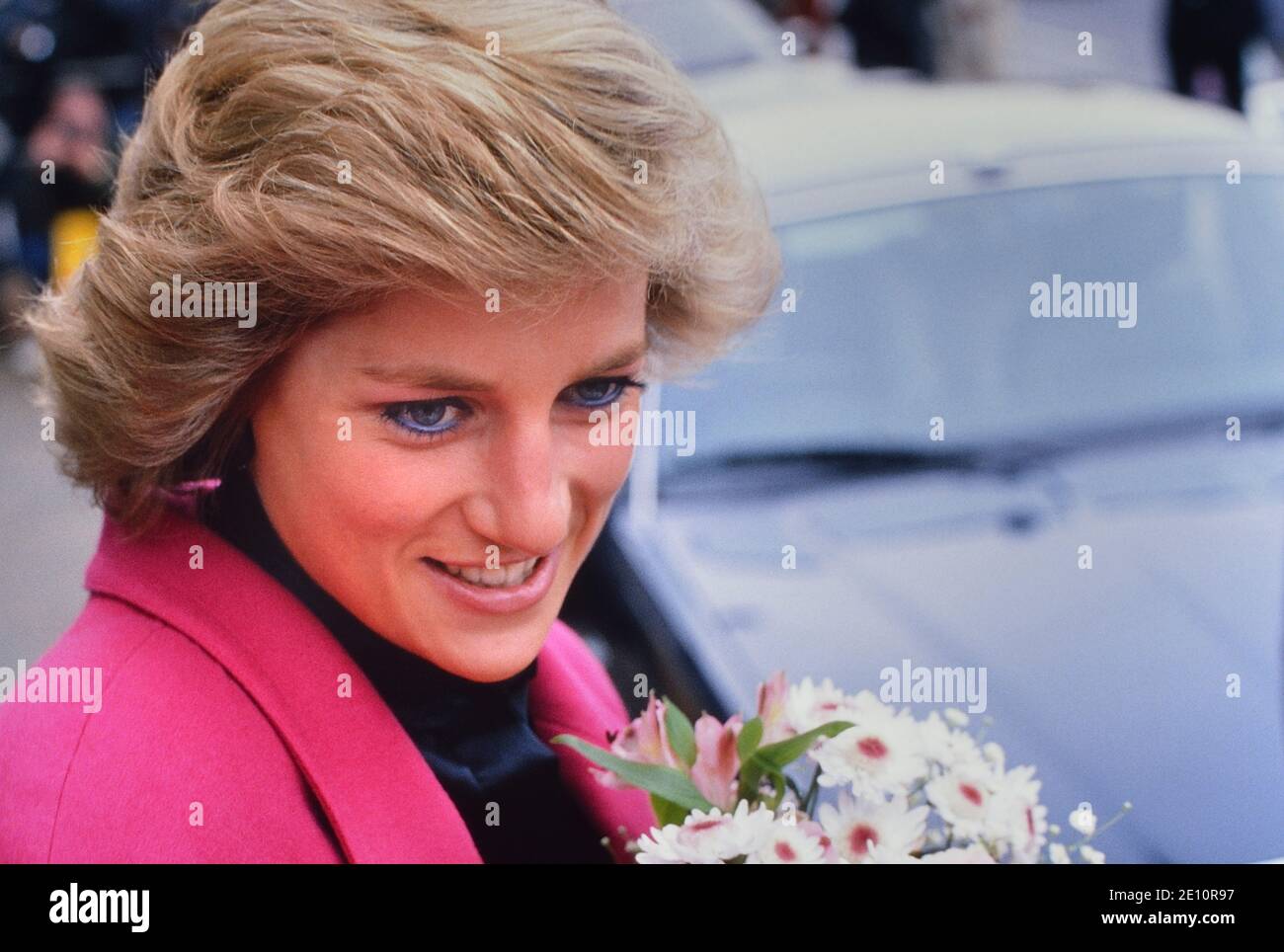 A smiling Diana, Princess of Wales receiving a bouquet of flowers during a visit to the Relate Marriage Guidance Centre in Barnet, north London, 29th November 1988 Stock Photo