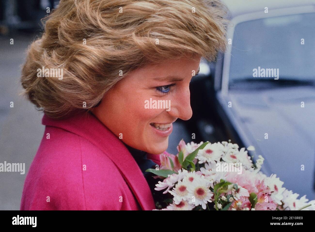 A smiling Diana, Princess of Wales receiving a bouquet of flowers during a visit to the Relate Marriage Guidance Centre in Barnet, north London, 29th November 1988 Stock Photo