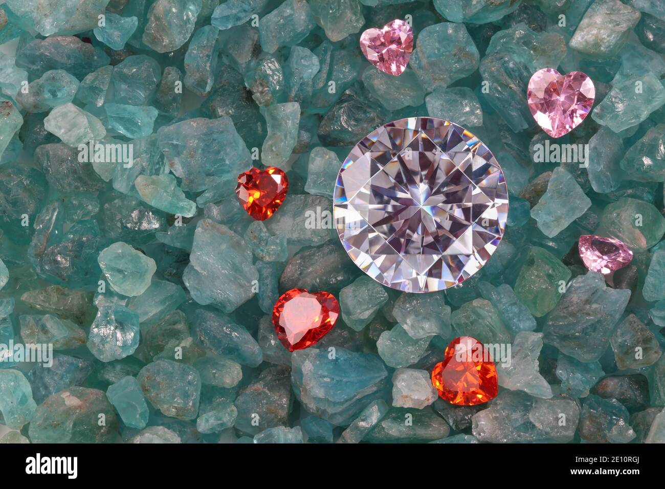 diamonds with jewelry in heart shape on sky blue gemstones Stock Photo