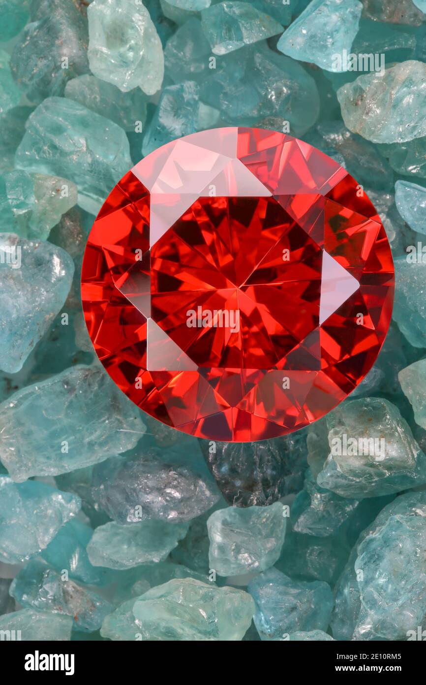 ruby red diamonds on raw sky blue gemstones Stock Photo Alamy