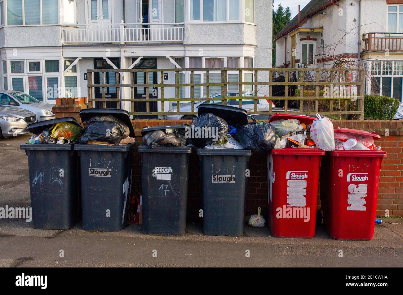 Slough, Berkshire, UK. 3rd January, 2021. Bins piled up awaiting