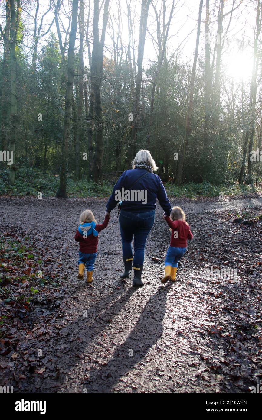 Parent with child on daily walk during lockdown, UK Stock Photo