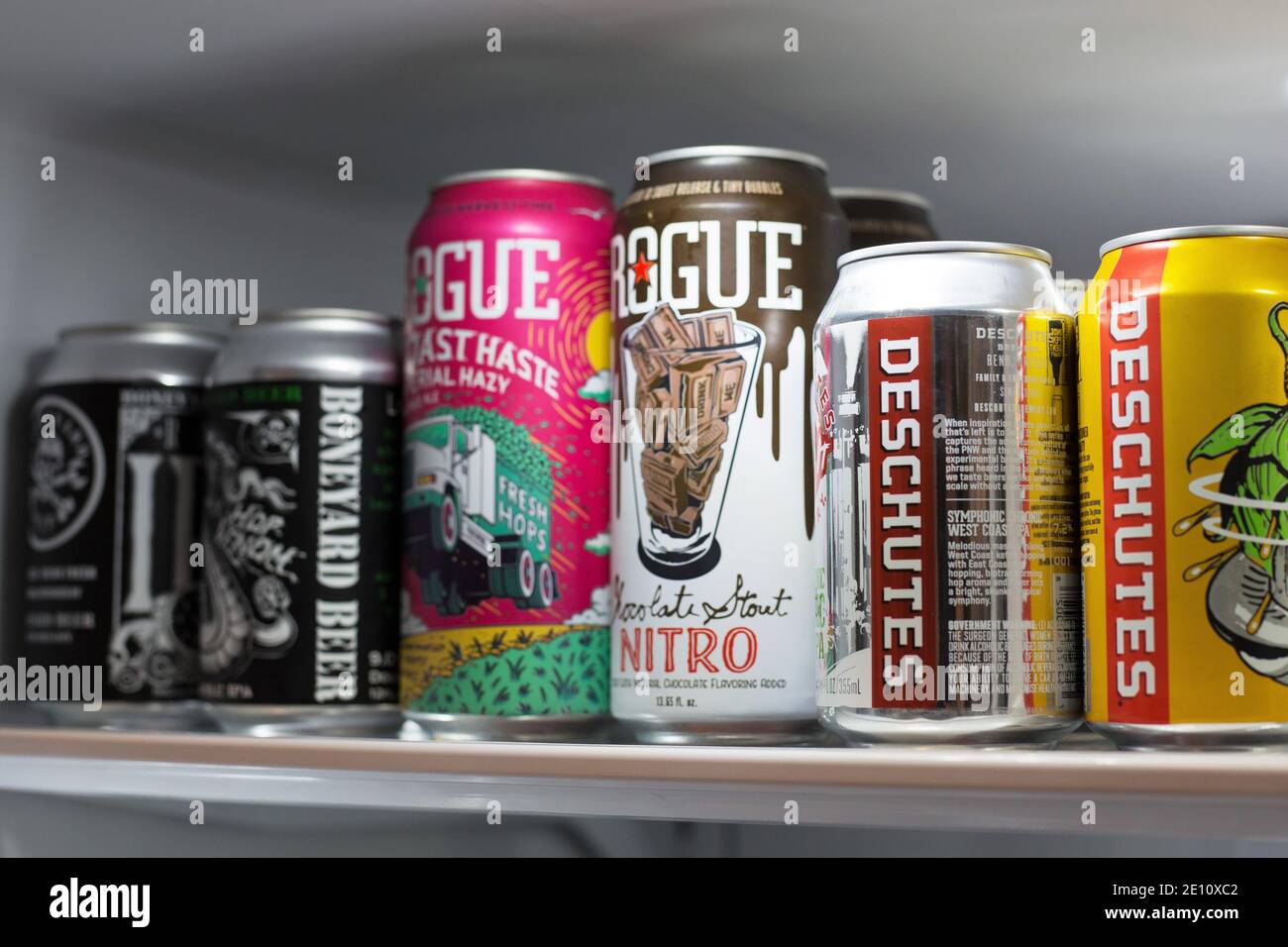 A refrigerator shelf filled with craft beers from Oregon breweries. Stock Photo