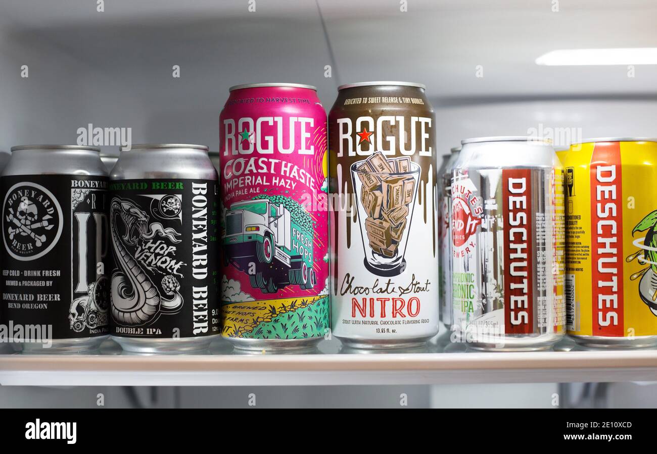 A refrigerator shelf filled with craft beers from Oregon breweries. Stock Photo