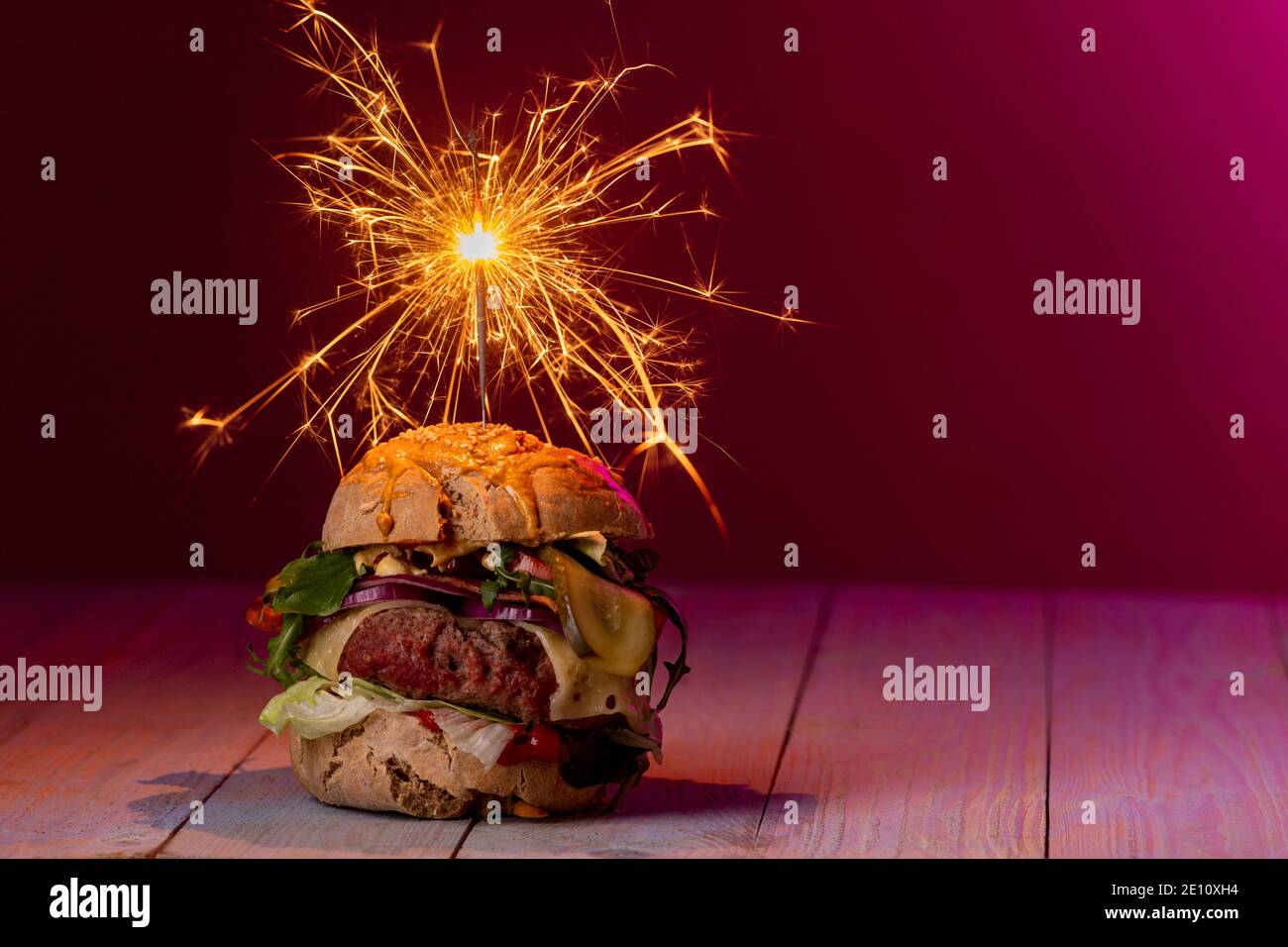 Cheeseburger With A Candle Stock Photo