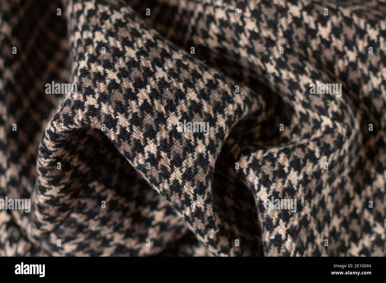 Brown warm wool fabric swatch houndstooth. Woven dogstooth check design background Stock Photo