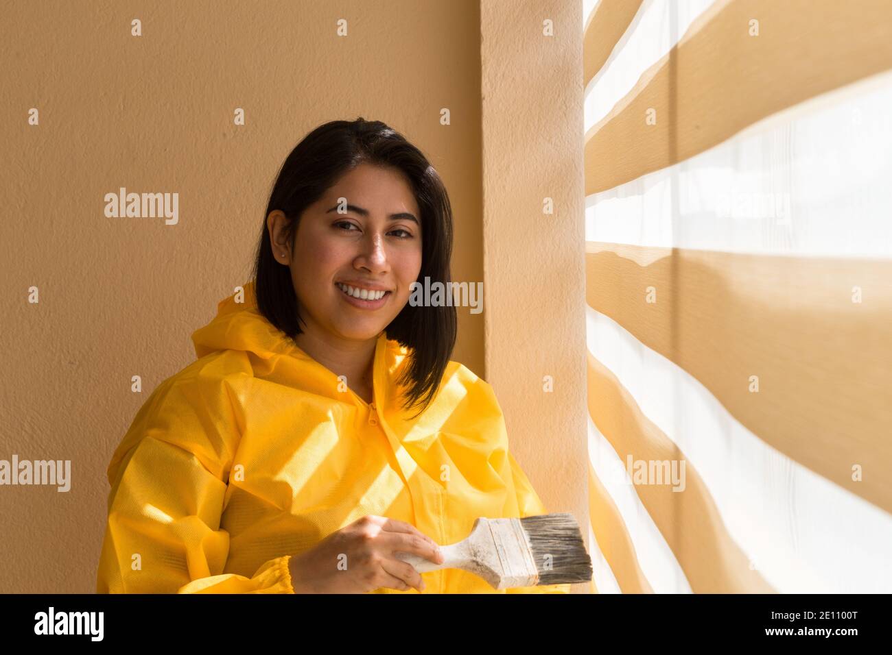summer, day, paint, wall, face, portrait, short, hair, black, yellow, impermeable, job, work, happy, new, department, house, home, young, girl, woman, Stock Photo