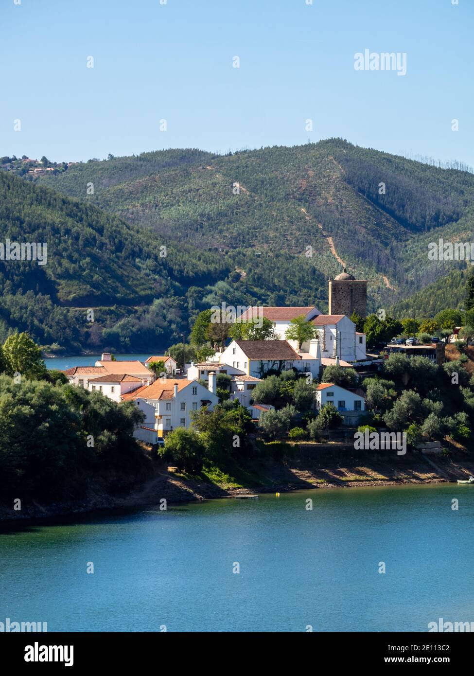 Dornes hamlet with the Templars tower overlooking between the forest and the Zezere River Stock Photo