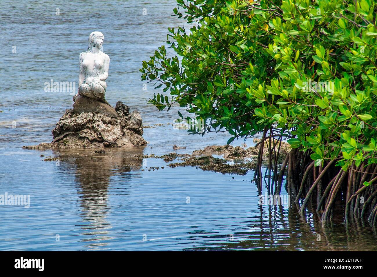 Statue of the Little Mermaid at the entrance to an inlet on Plantation Key in the Florida Keys. Stock Photo