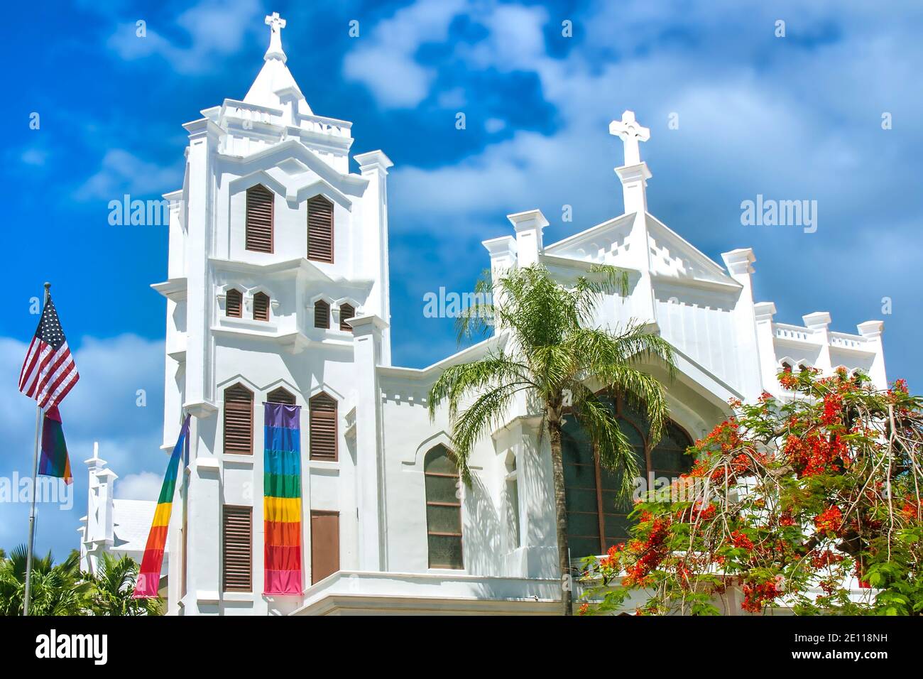 Rainbow Banners for Gay Pride Weekend hang on St. Paul's Episcopal Church in Key West, the Florida Keys. Stock Photo