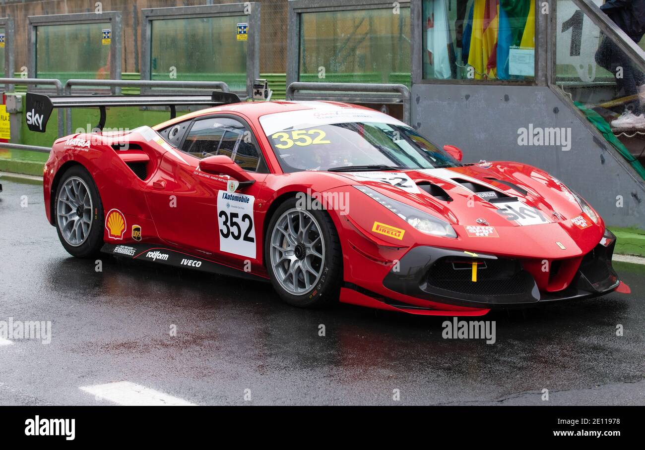 Ferrari supercar 488 gran turismo racing motorsport in circuit pit lane track wet asphalt Stock Photo