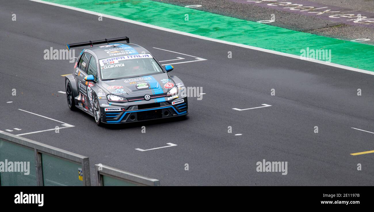 Volkswagen Golf racing car action race on straight asphalt track Stock Photo