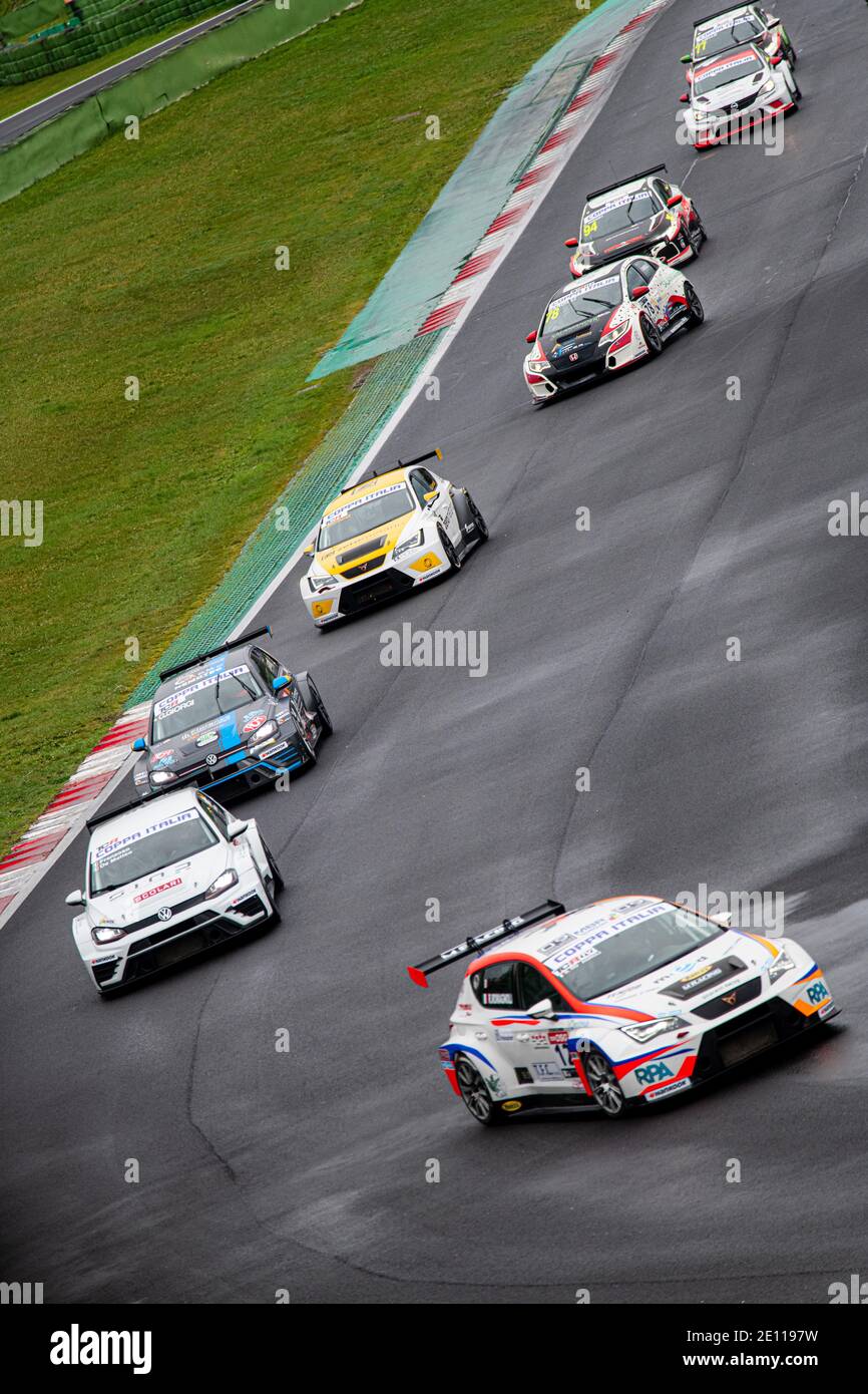 Group of racing touring cars action challenging during the race at turn Stock Photo