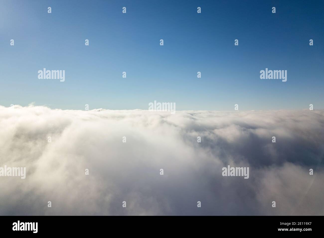 Aerial view from above of white puffy clouds in bright sunny day Stock ...