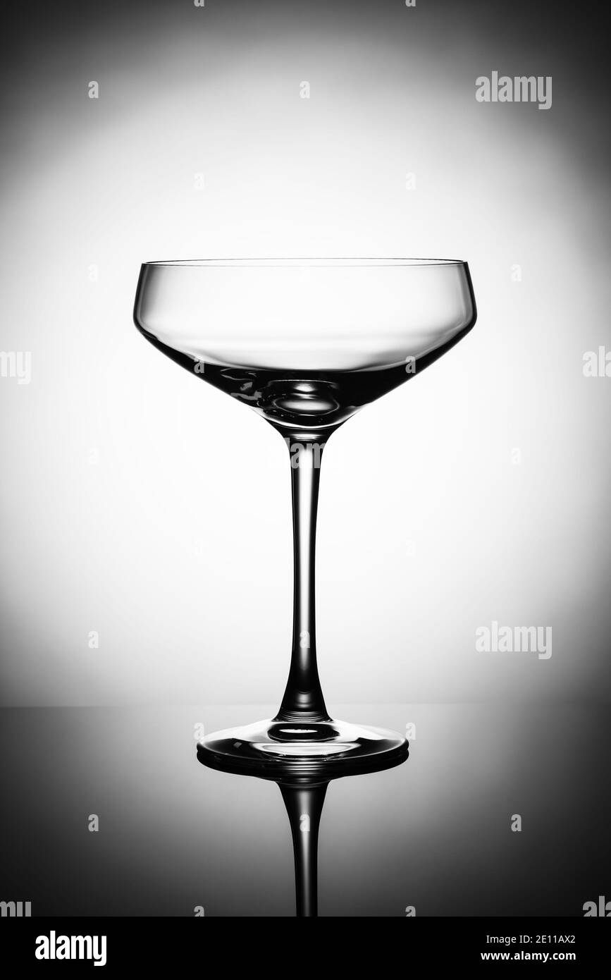 Empty alcohol glasses silhouette on a light background Stock Photo