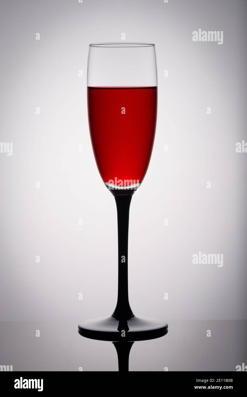 A glass of red wine on a white background Stock Photo - Alamy