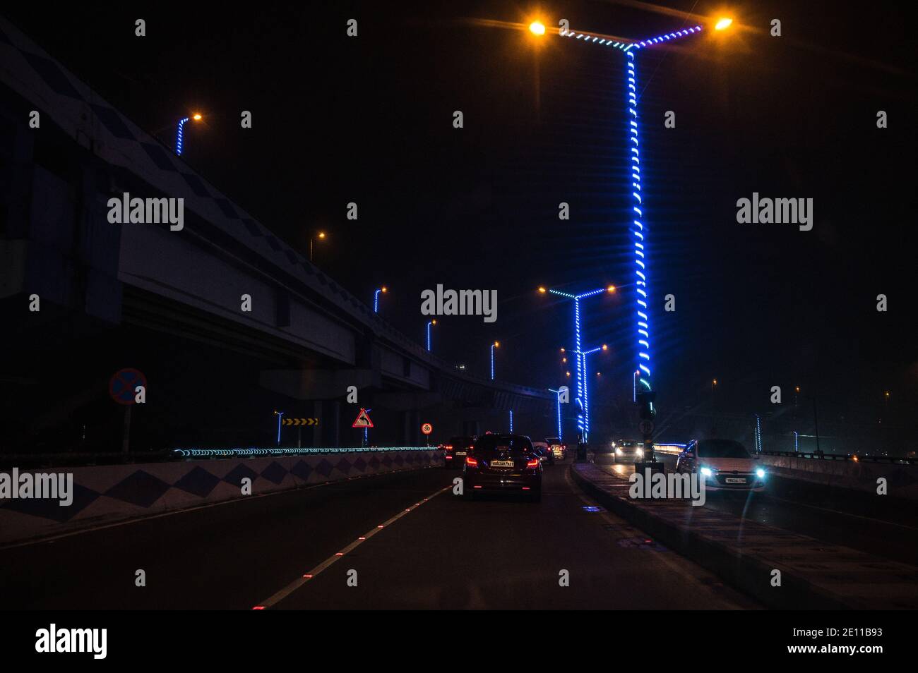 The beauty of the Parama Island flyover at night, also popularly known as Maa flyover is a 9.62 km (5.98 mi) long flyover in Kolkata. It is built as a traffic corridor from Alipore to Eastern Metropolitan Bypass, Kolkata. West Bengal. Stock Photo