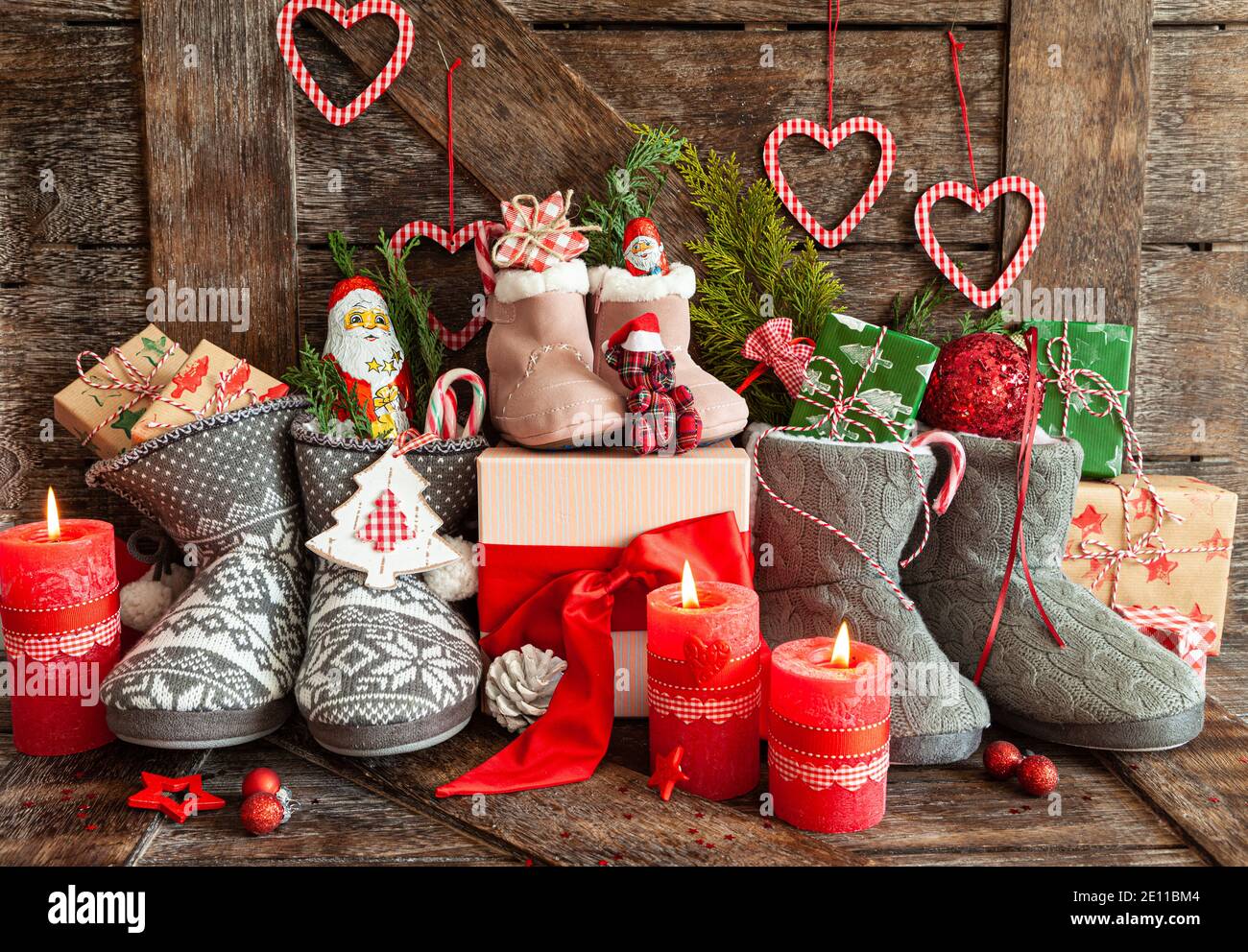 Knitted Boots With Candy And Christmas Presents Stock Photo