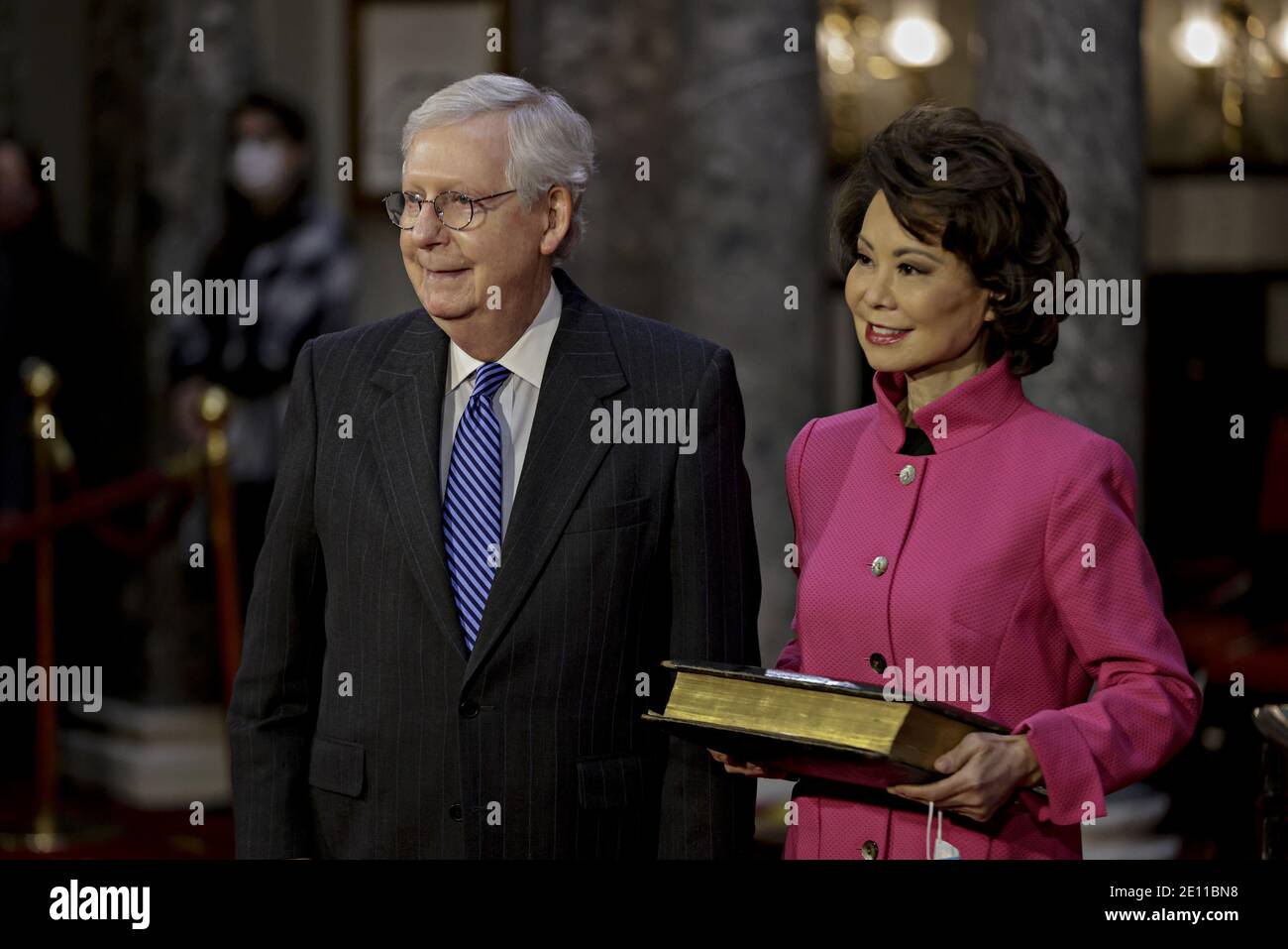 Washington, United States. 03rd Jan, 2021. Senate Majority Leader Mitch McConnell, a Republican from Kentucky, left, waits to be ceremoniously sworn-in with wife Elaine Chao, U.S. secretary of transportation, at the U.S. Capitol in Washingtonat the U.S. Capitol in Washington, DC on Sunday, January 3, 2021. The 117th Congress begins today with the election of the speaker of the House and administration of the oath of office for lawmakers in both chambers, procedures that will be modified to account for Covid-19 precautions. Pool photo Samuel Corum/UPI Credit: UPI/Alamy Live News Stock Photo