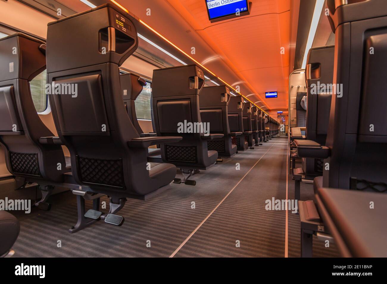 Train compartment from the German railways. without passengers in the aisle and on the seats. Illuminated corridor with no people in the first class c Stock Photo