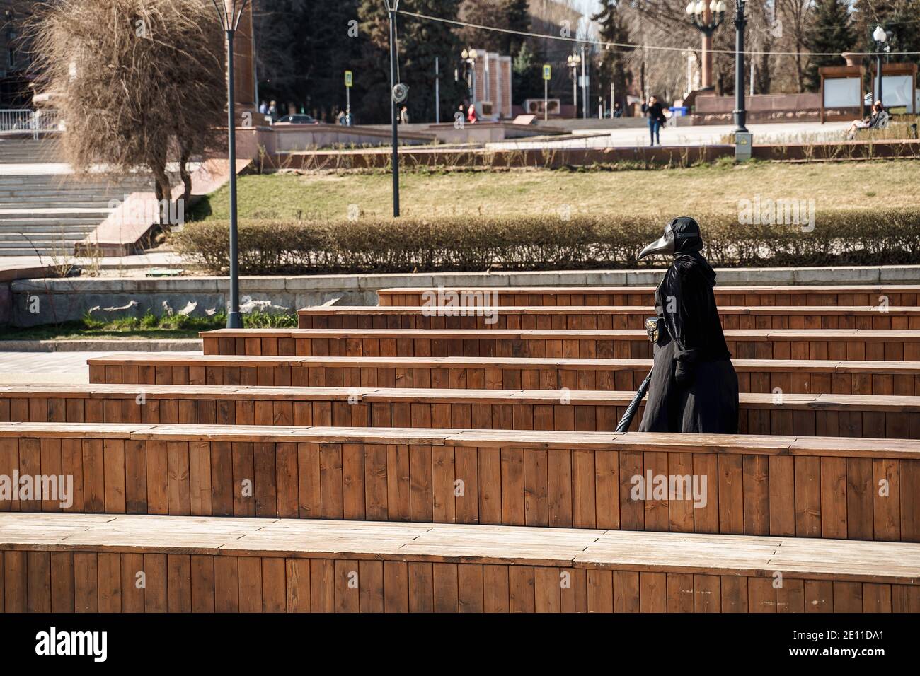 Plague Doctor In An Empty City Park Stock Photo Alamy