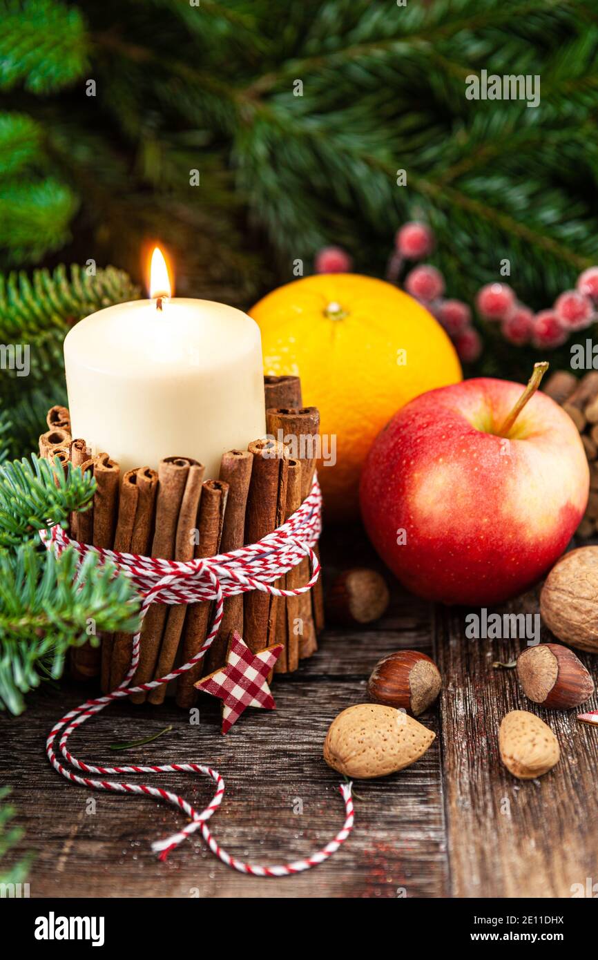 Burning Candle And Rustic Decorations Stock Photo