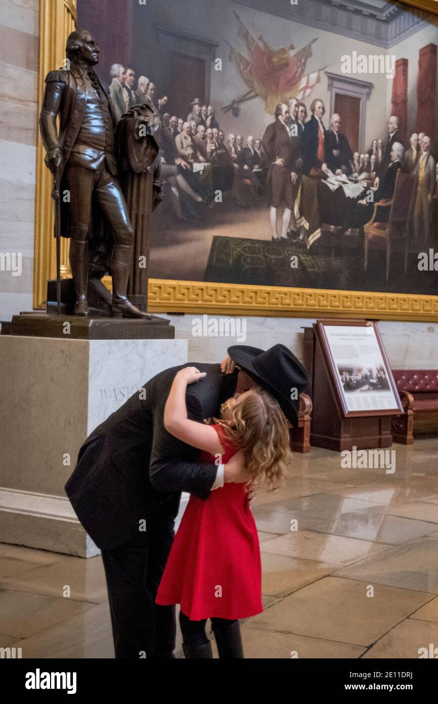 United States Representative-elect Troy Nehls (Republican of Texas) hugs his eight year-old daughter Tori Nehls in the Rotunda at the U.S. Capitol as the 117th Congress prepares to convene in Washington, DC, Sunday, January 3, 2021. Credit: Rod Lamkey/CNP | usage worldwide Stock Photo