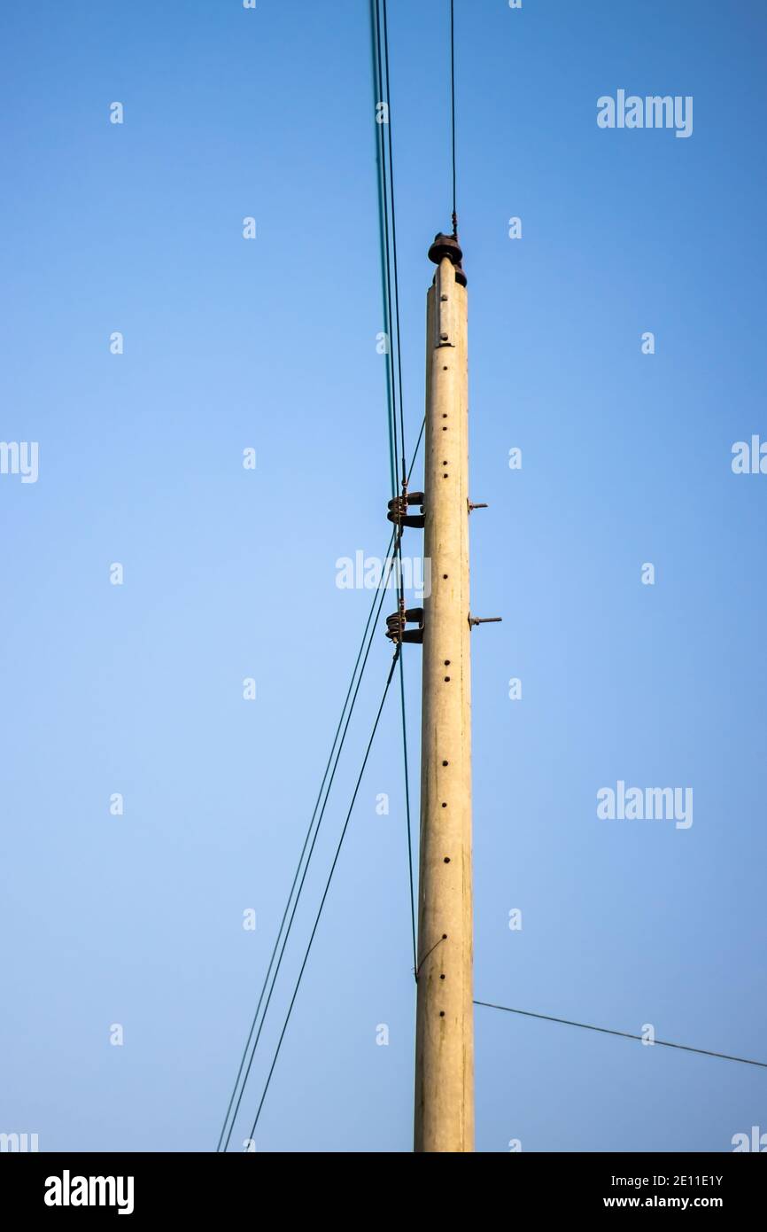 Electricity pole with wire under the blue sky Stock Photo - Alamy