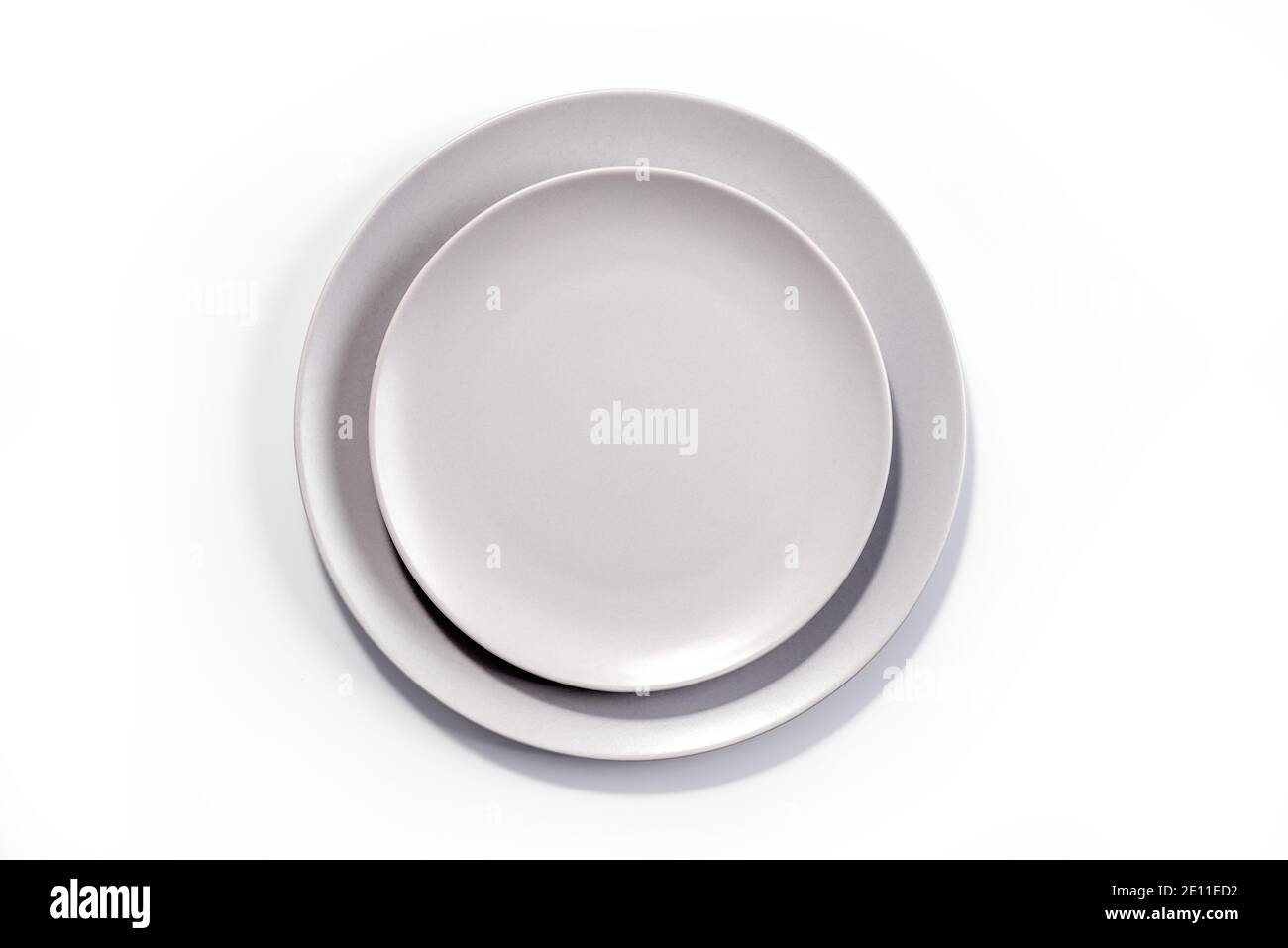 Empty Matte Grey Dish Set isolated on white background top view Stock ...