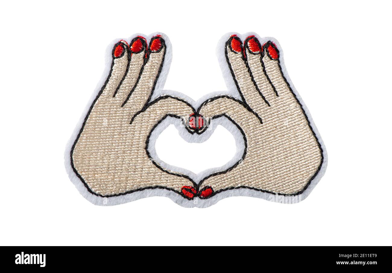 Hands making heart shape, embroidered batch isolated on white background Stock Photo