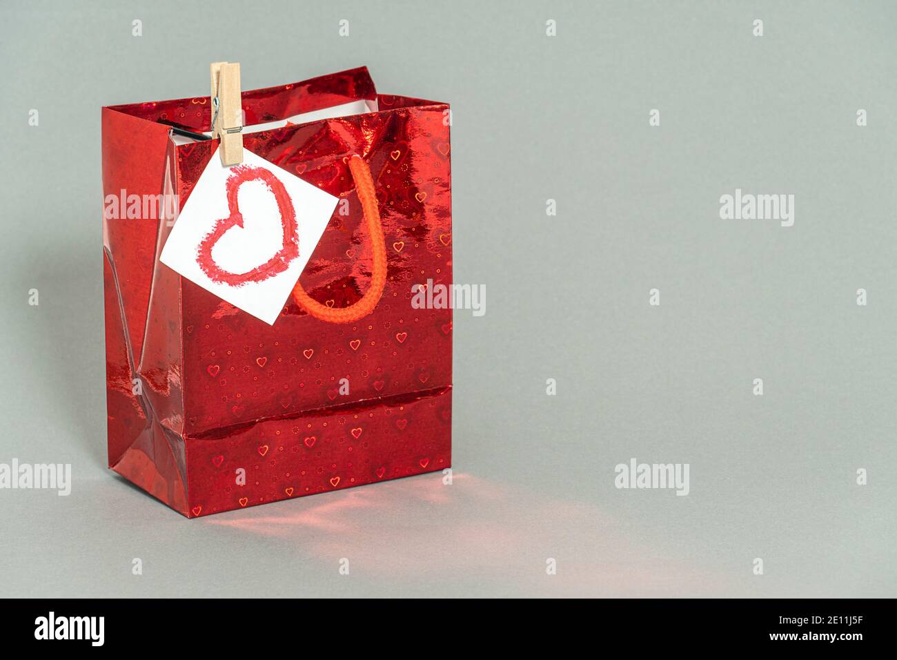 red gift package on a gray background. high quality Stock Photo