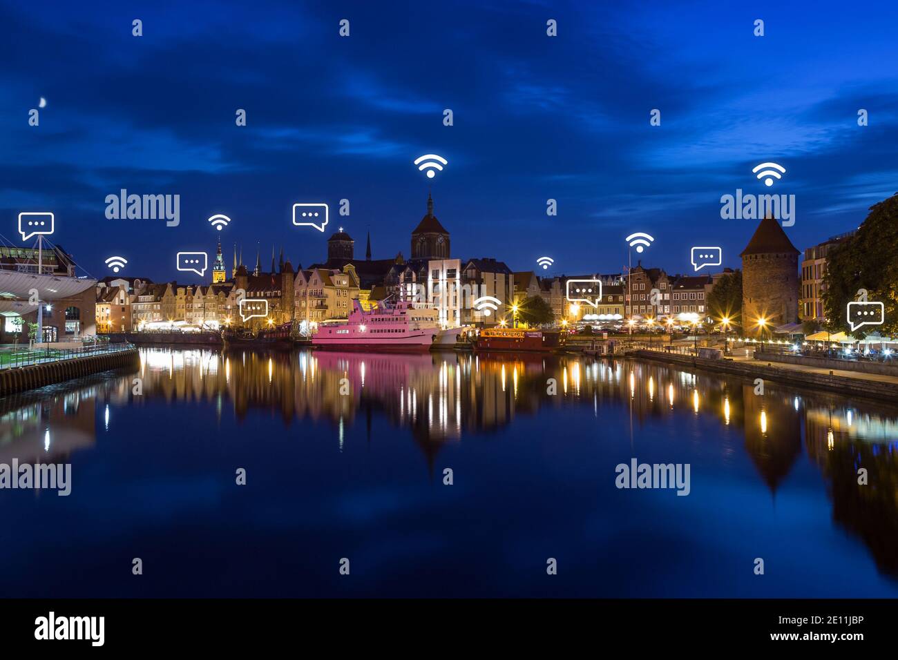Motlawa River and old buildings at the Old Town in Gdansk, Poland, at dusk.  Wireless network connection, WiFi, smart city and online messaging concept  Stock Photo - Alamy