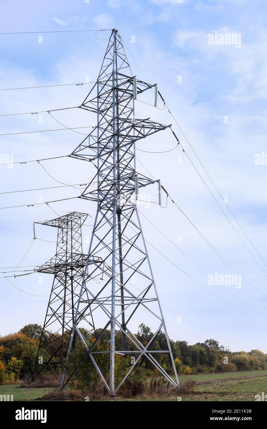 High voltage power tower and nature landscape at day. Stock Photo