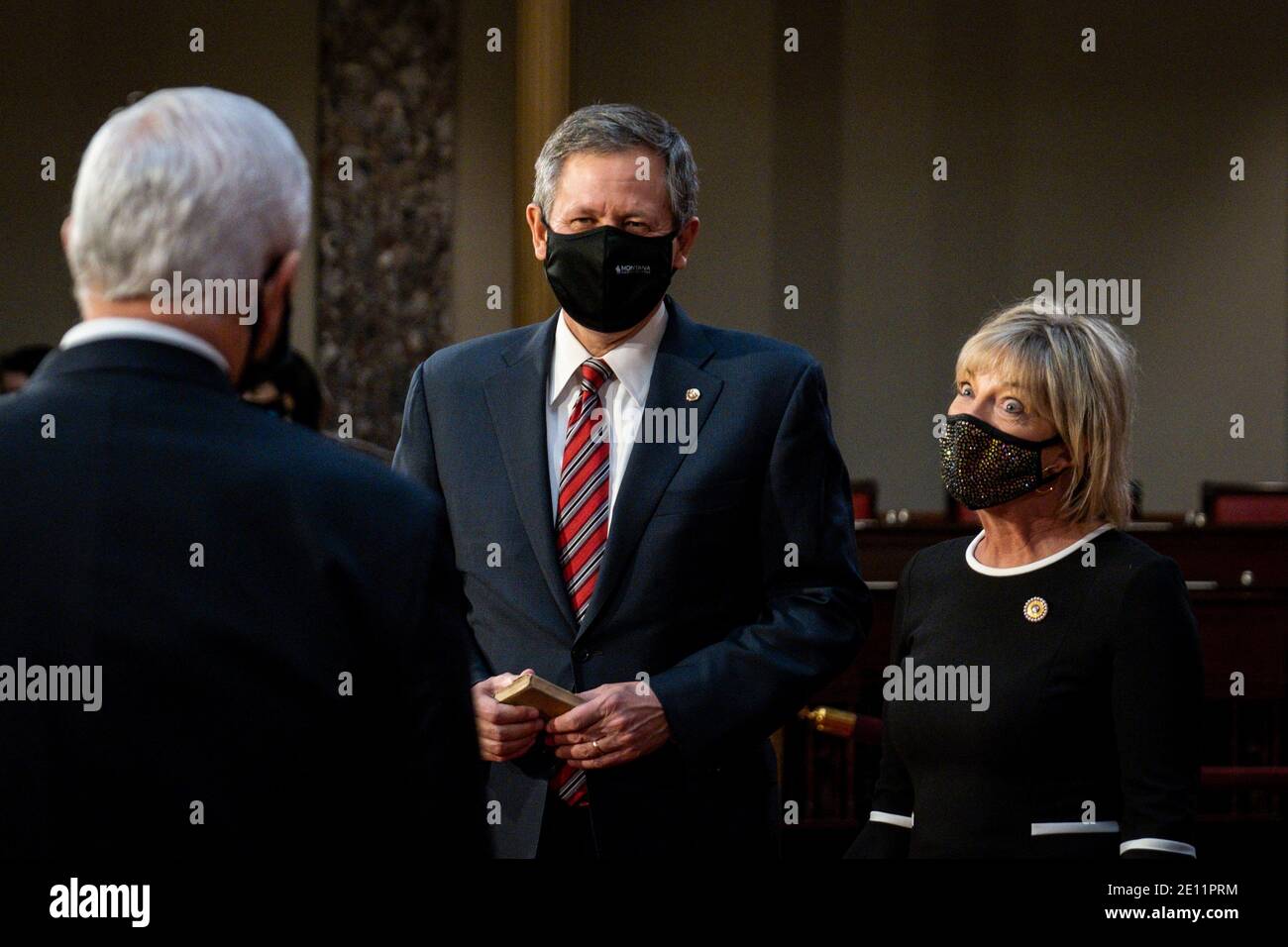 Washington, USA. 03rd Jan, 2021. Vice President Mike Pence speaks with Senator Steve Daines (R-MT) and his wife, Cindy, during a mock swearing-in ceremony in the Old Senate Chamber on Capitol Hill on January 3, 2021 in Washington, DC. (Photo by Pete Marovich/Pool/Sipa USA) Credit: Sipa USA/Alamy Live News Stock Photo