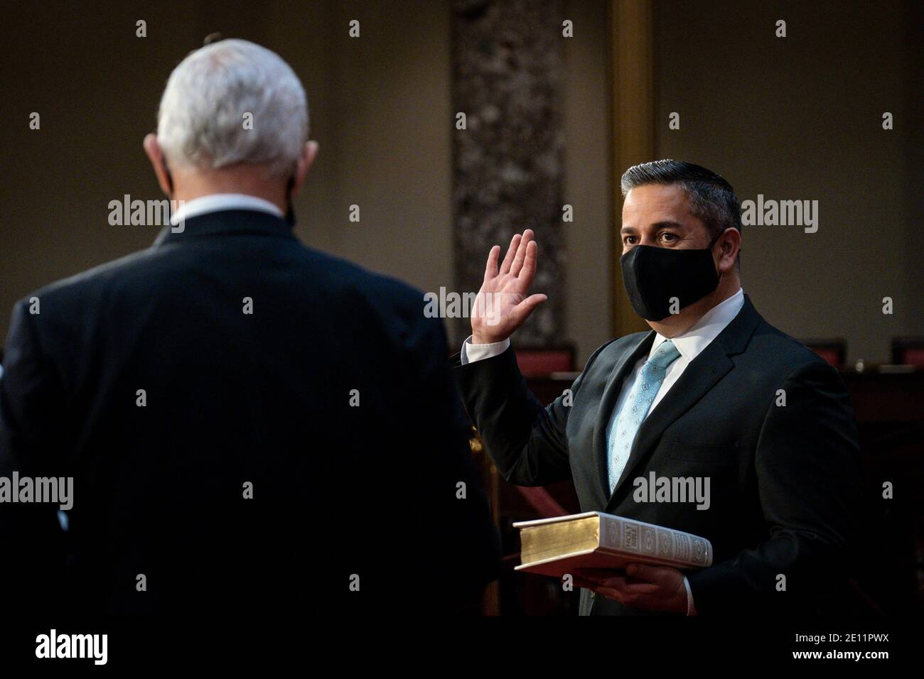 Washington, USA. 03rd Jan, 2021. Vice President Mike Pence administers the Senate oath of office to Ben Ray Lujan (D-NM), during a mock swearing-in ceremony in the Old Senate Chamber on Capitol Hill on January 3, 2021 in Washington, DC. (Photo by Pete Marovich/Pool/Sipa USA) Credit: Sipa USA/Alamy Live News Stock Photo