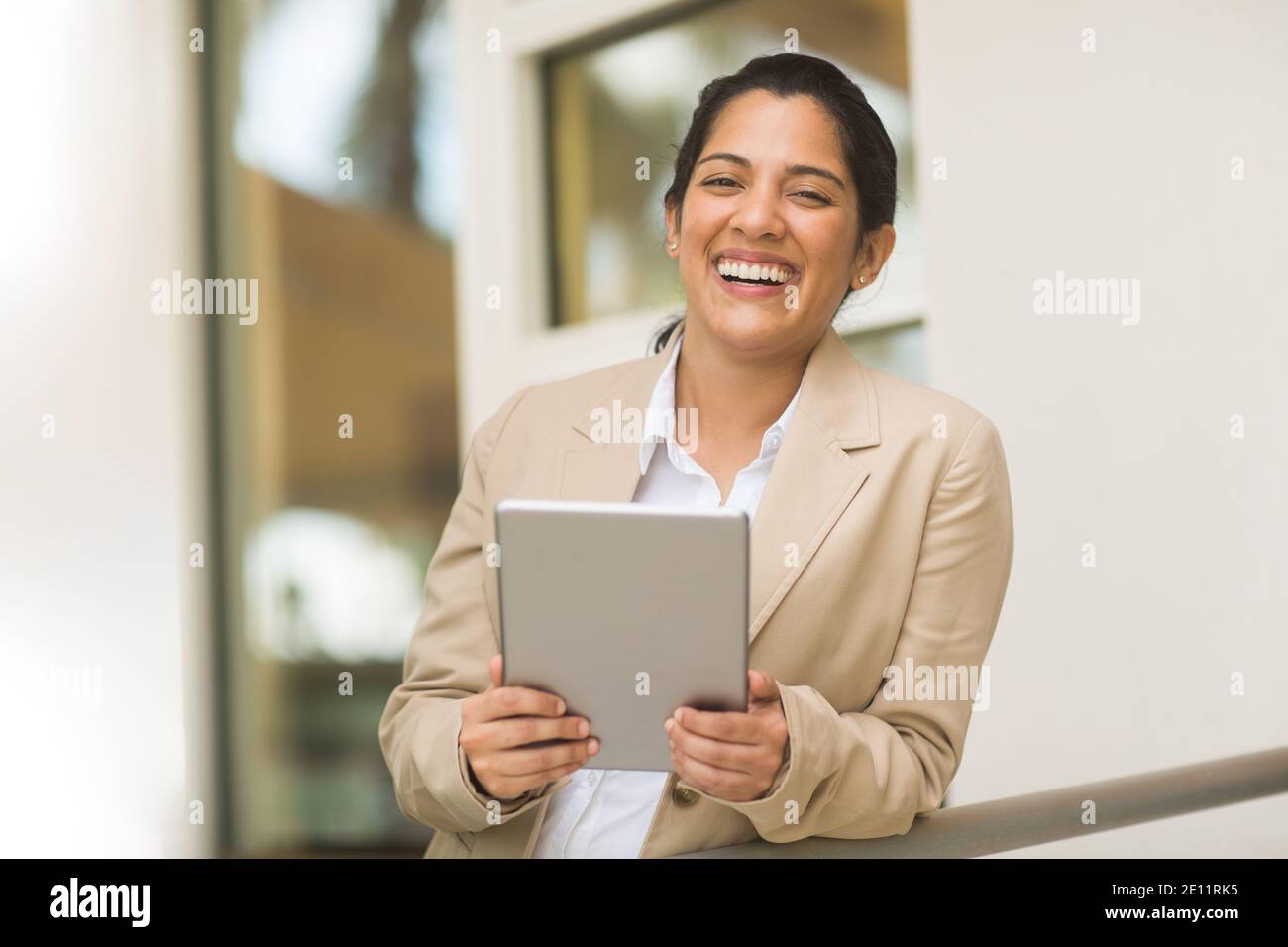 Hispanic business woman smiling outside stock photo Stock Photo